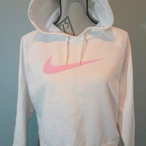 Cropped Nike hoodie with a pink Nike logo.